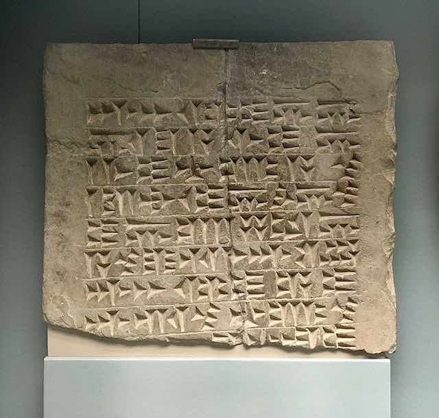 A tablet of stone with cuneiform inscription praising the god Haldi
